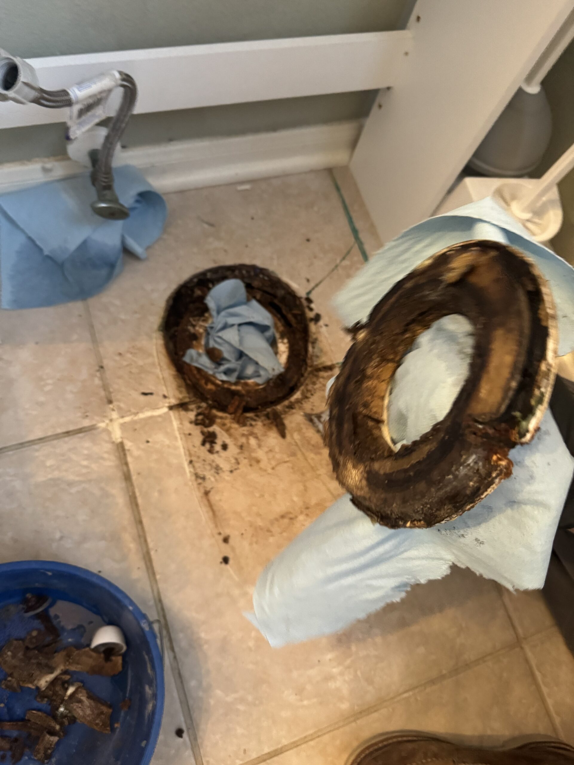 Rotted subfloor caused by a long-term leaking toilet flange in a Spring, TX home