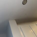 Ceiling damage from water leak caused by a failing toilet flange above in Spring, TX
