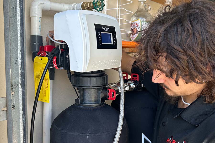 Bears Plumbing expert installing a residential water filtration system in Spring, TX