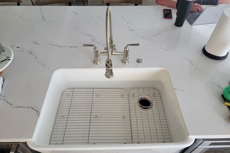 Kitchen faucet repair in Spring TX with a modern sink