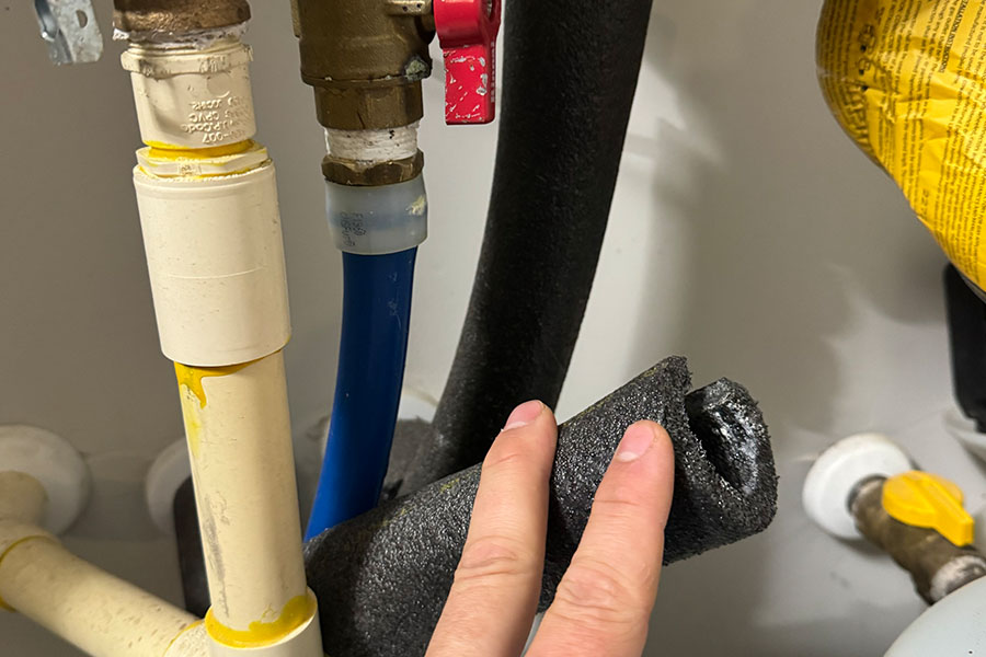 Tankless water heater lines checked during plumbing inspection in Spring TX