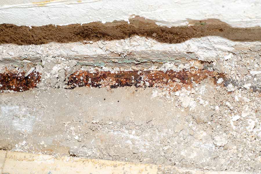 Corroded underground pipe exposed during slab leak repair in Spring, TX