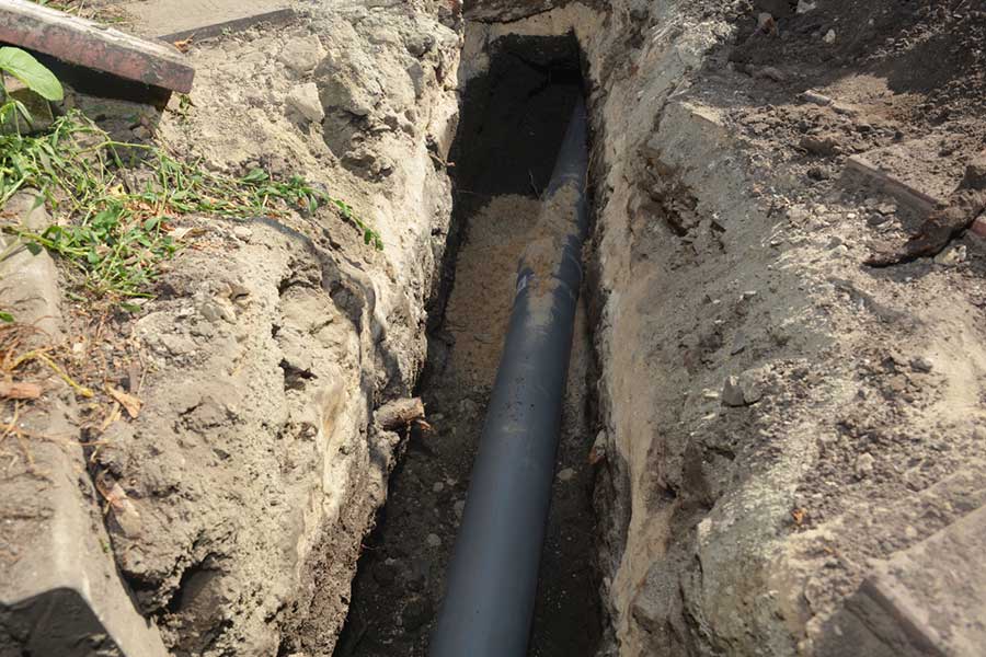 Drain pipe repair underway in a Spring TX trench