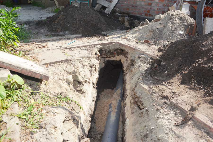 Drain pipe repair work in an excavated trench in Spring TX