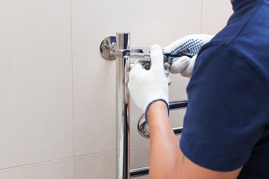 Bears Plumbing plumber installing shower fixtures in Spring, TX