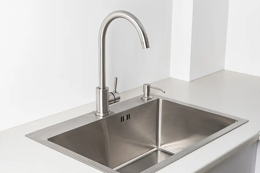 Professionally installed stainless steel kitchen sink for homeowners in Spring, TX